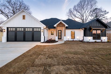 white metal house with black trim|black and white exterior home ideas.